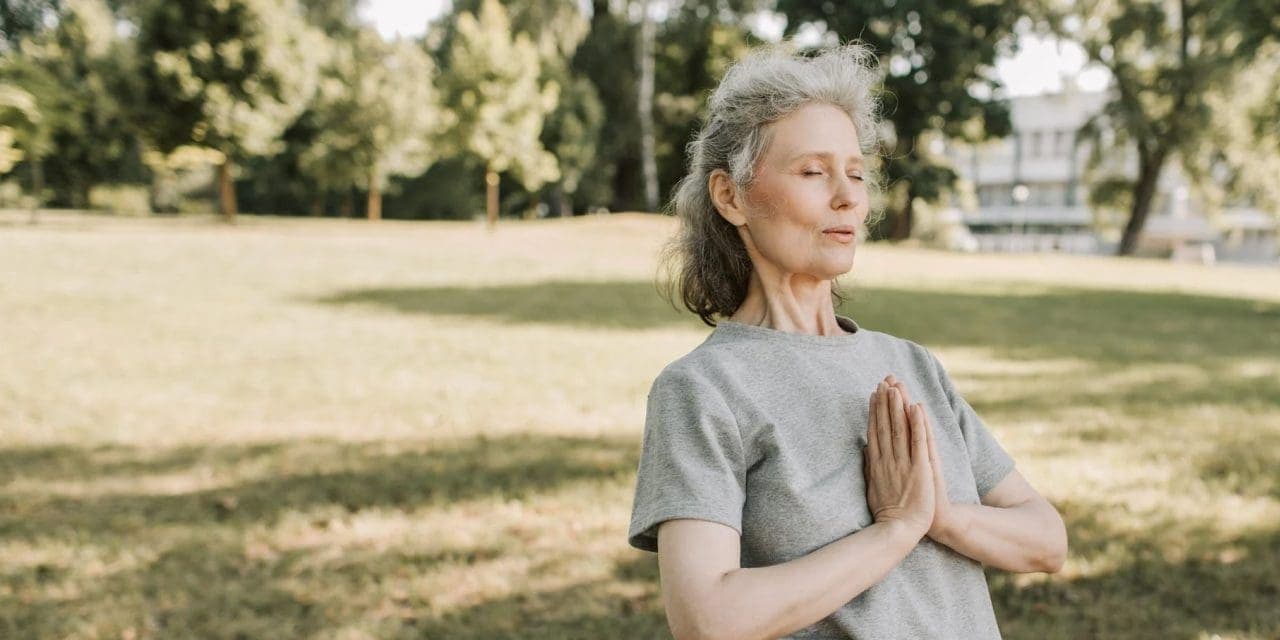 old woman doing yoga